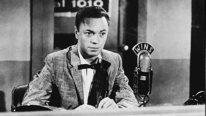 alan freed sat in suit at mic
