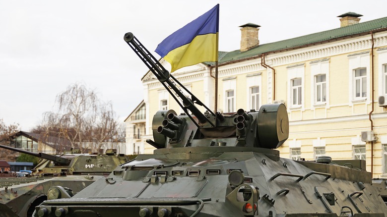 Ukraine flag over Russian tank