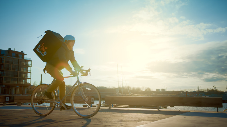 Bicycler carrying food delivery