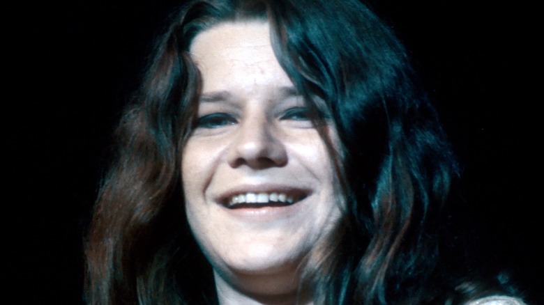 Janis Joplin smiling on-stage