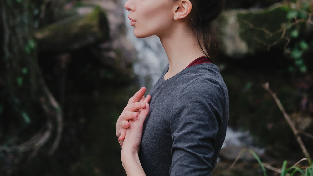 Woman breathing in a forest