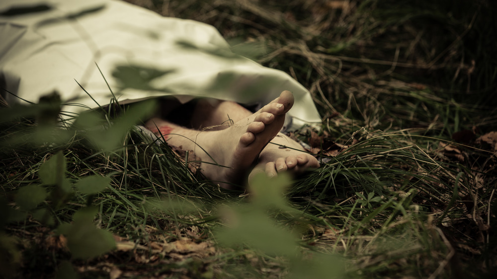 bare feet and body in forest