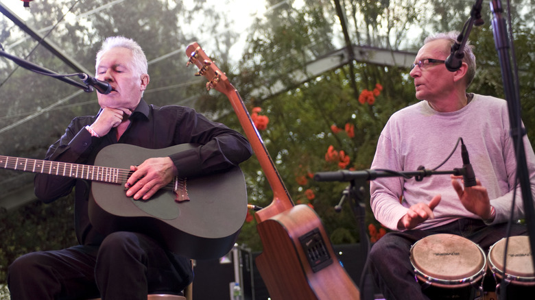 Original members of Comus performing on small stage