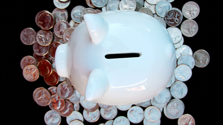 Piggy bank surrounded by Bicentennial Quarters
