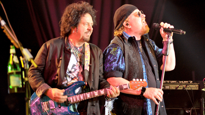 Steve Lukather and Joseph Williams performing
