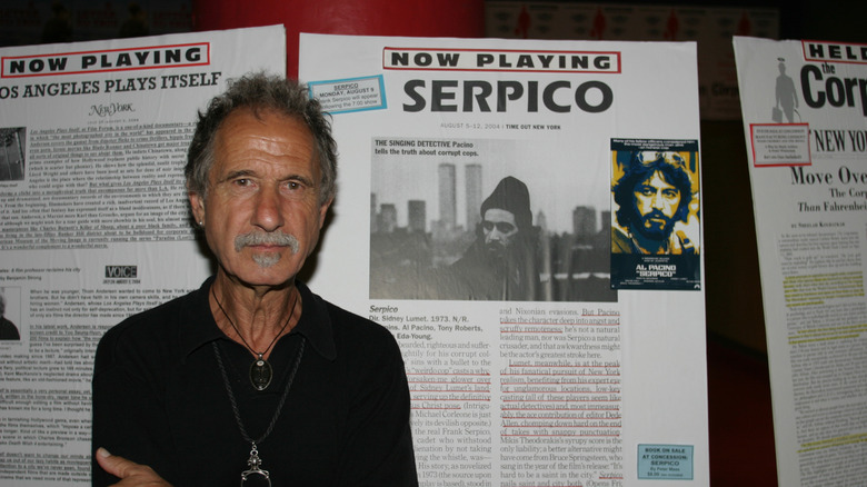 Frank Serpico posing with movie poster