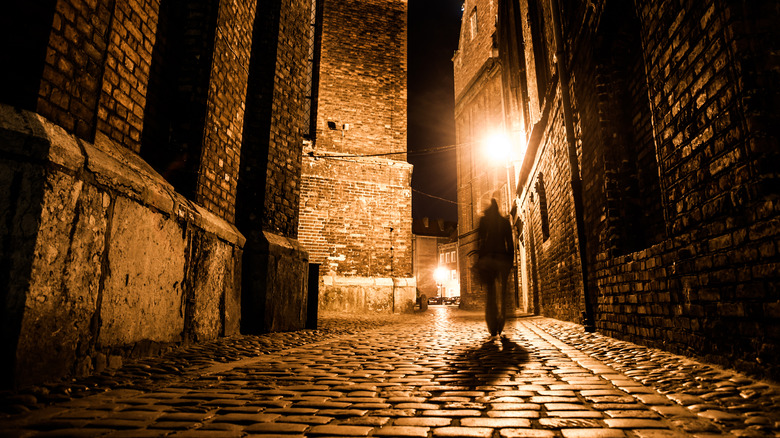 Dark blurred silhouette of person