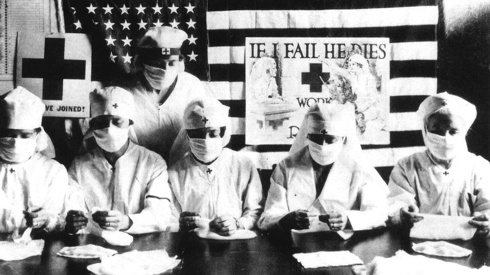 Red Cross nurses  folding bandages