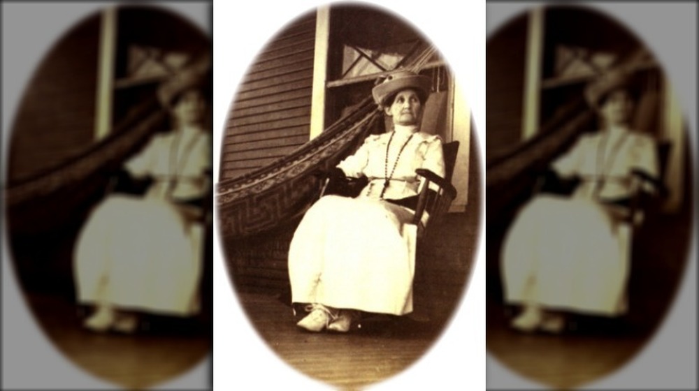 Alice Brown Davis, sitting in rocking chair