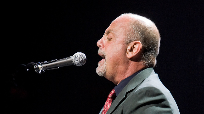 Billy Joel singing microphone bald