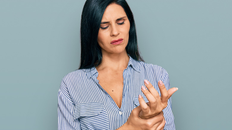 woman in finger pain