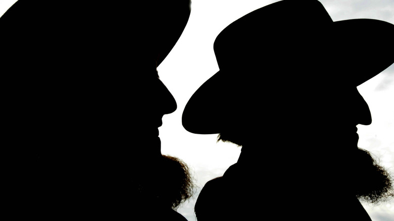 silhouettes of two amish men