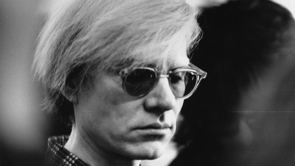 Andy Warhol posing