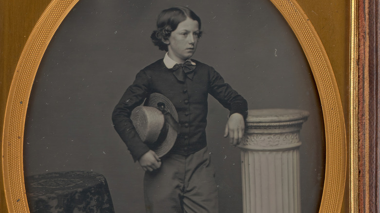 young boy wearing pants