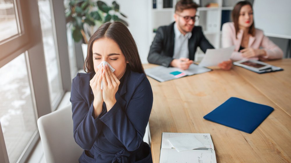 sneezing woman