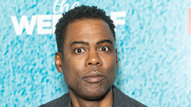 chris rock turquoise background