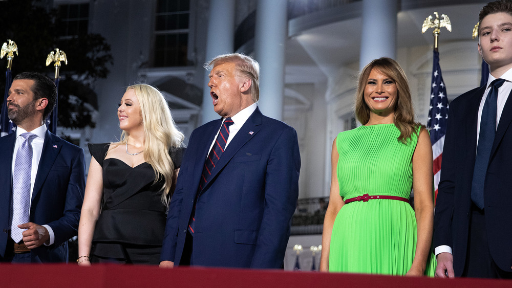 Donald Trump standing with family