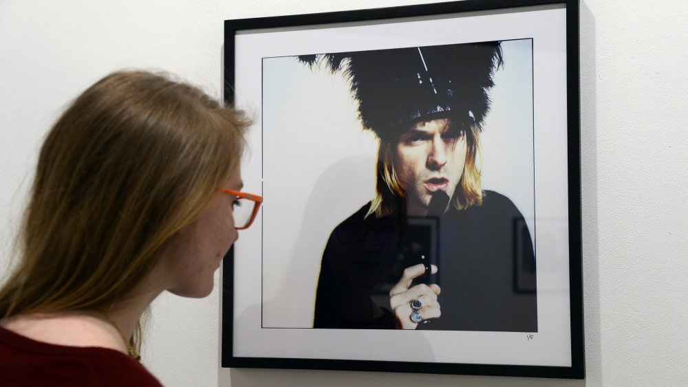 Woman gazes upon photo of Kurt Cobain