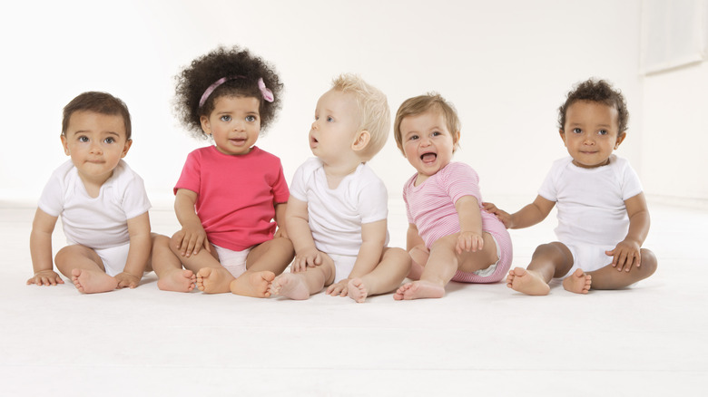 babies sitting in a row