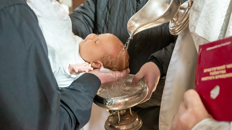 a baby is baptized