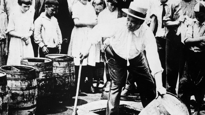 Man destroying beer barrel Prohibition