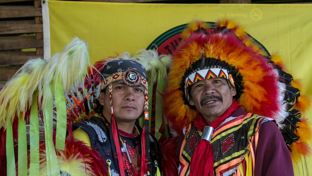 Cherokee dancers pose for the camera along a highway in Cherokee, North Carolina