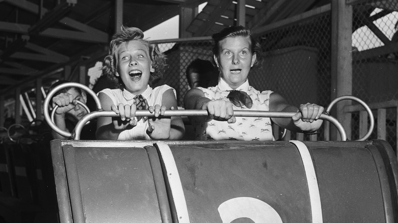 people riding roller coaster