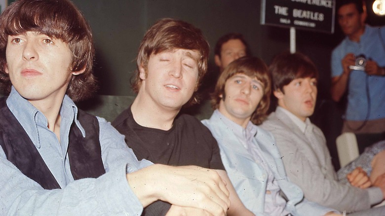 Beatles posing for band photo