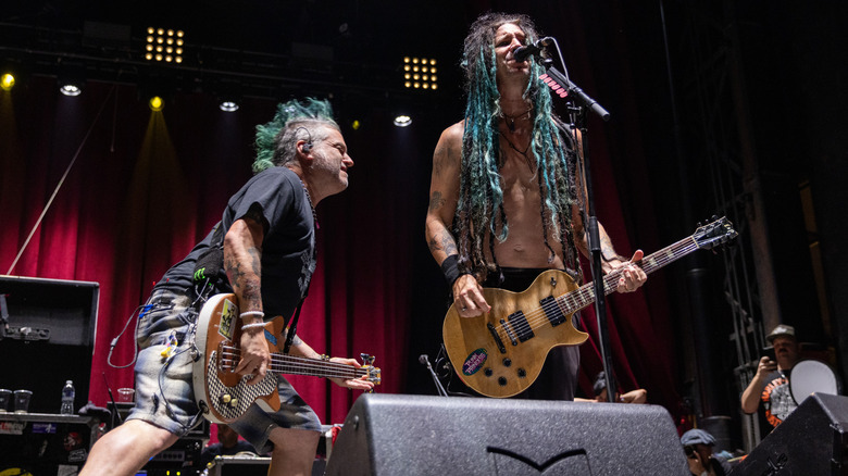 NOFX Fat Mike playing bass on stage