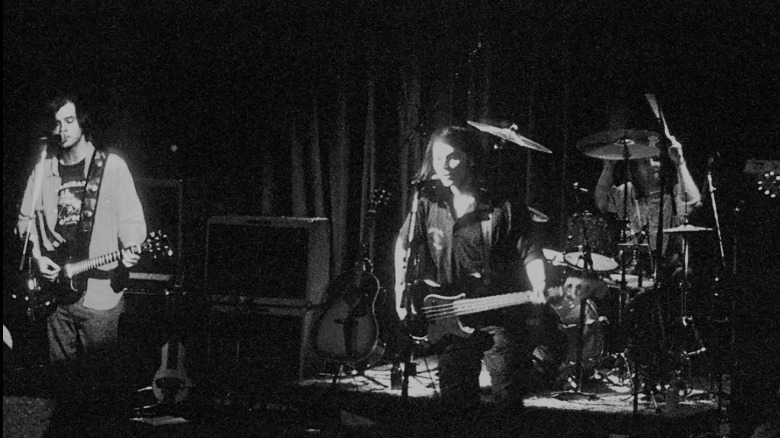 Uncle Tupelo performing on a dark stage