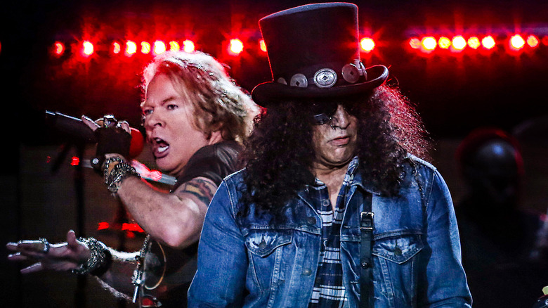 Axl Rose and Slash performing on stage