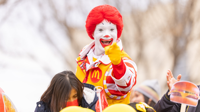 Ronald McDonald smiling and pointing