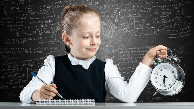 Schoolgirl with clock