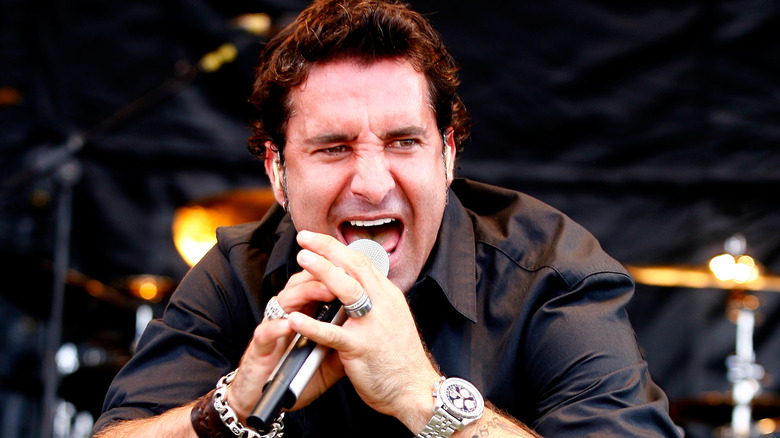 scott stapp singing mic on stage