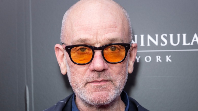 Michael Stipe in orange-lensed glasses