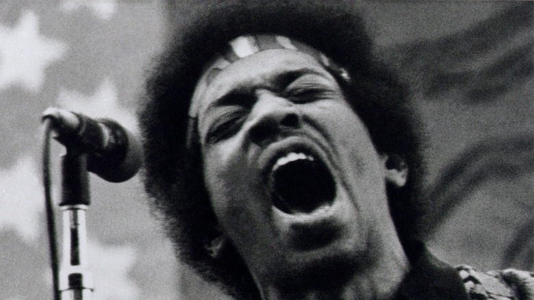 Jimi Hendrix performing