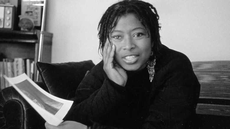 Alice Walker holds head in hand