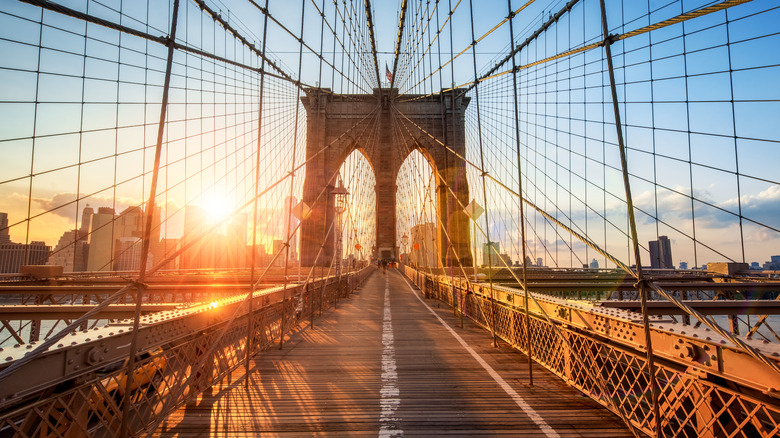 brooklyn bridge with sun gleaming