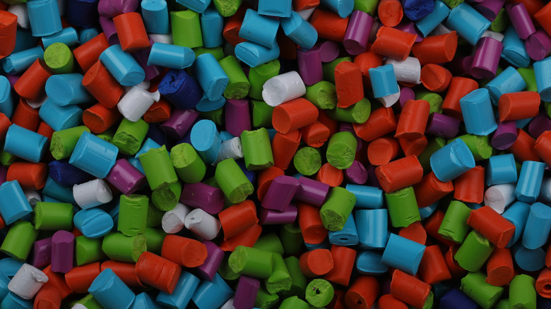Raw batch of multicolored plastic polymers