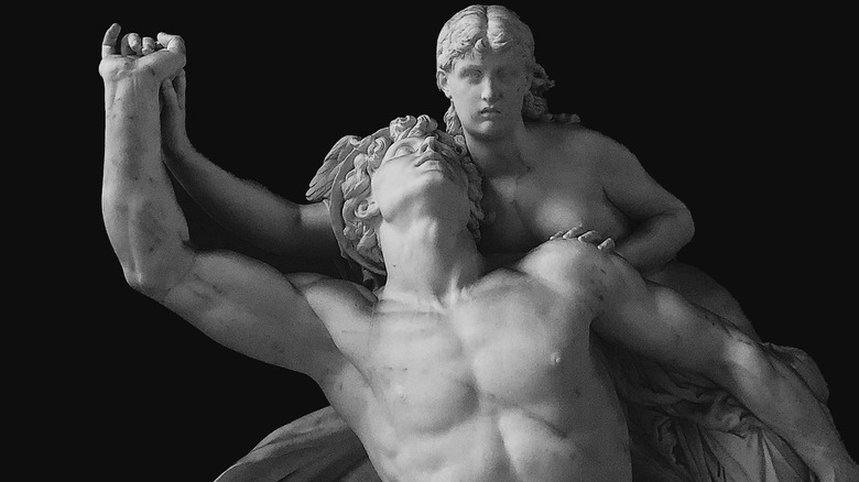 Greek sculptures clutching hands