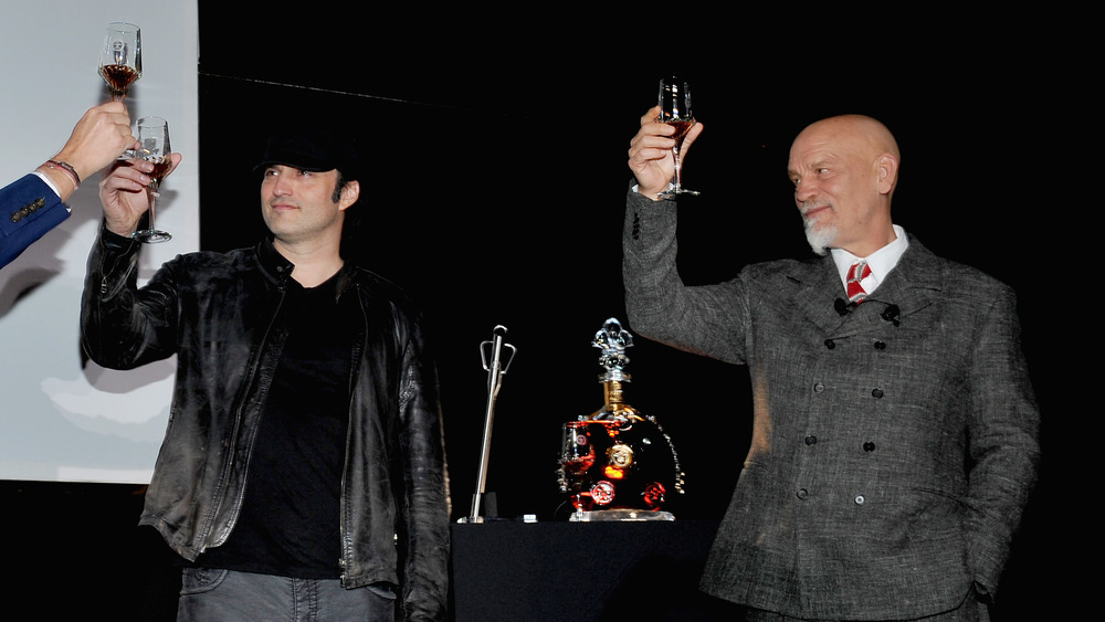 Robert Rodriguez and John Malkovich at a promotional event for Louis XIII Cognac's '100 Years'