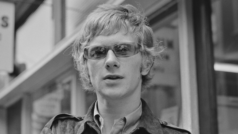 Andrew Loog Oldham wearing sunglasses