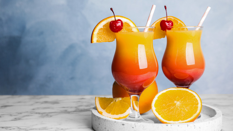 Two glasses of Tequila Sunrise on table