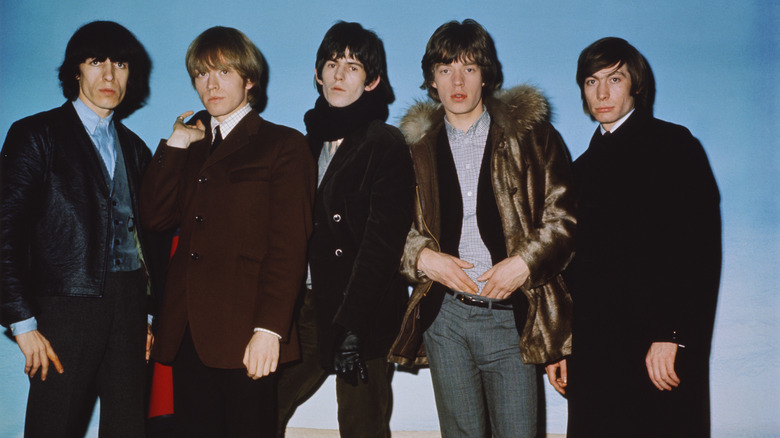 The Rolling Stones posing for a photo in 1964
