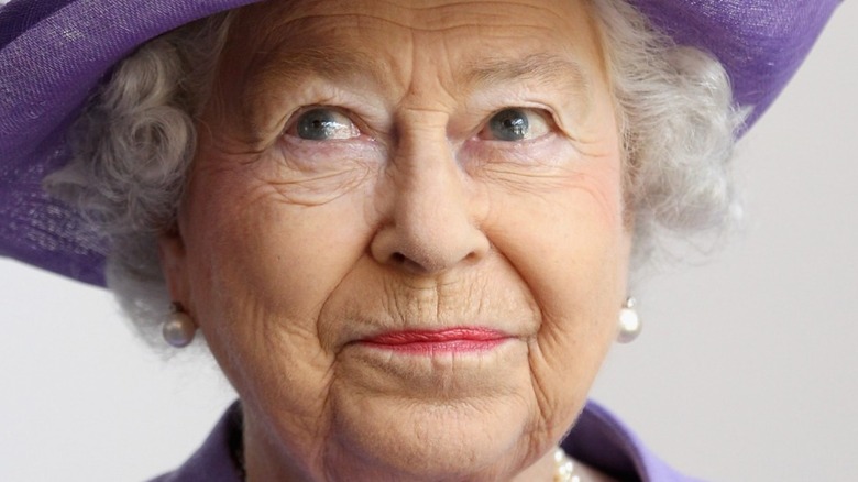 Queen Elizabeth in purple hat