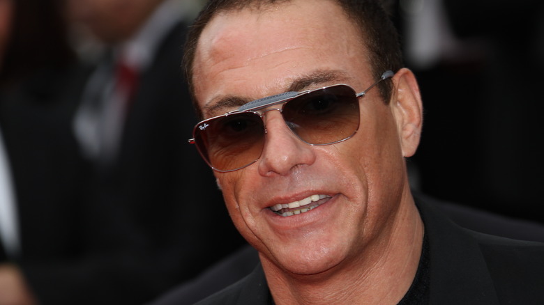 Jean-Claude Van Damme wearing glasses