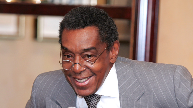 Don Cornelius gray suit smiling