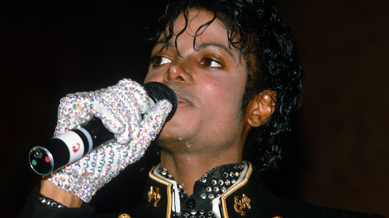 Michael Jackson holding microphone