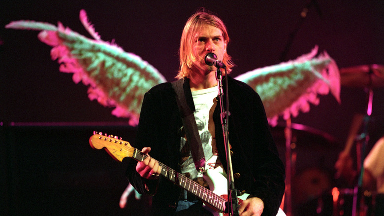 Kurt Cobain performing on stage