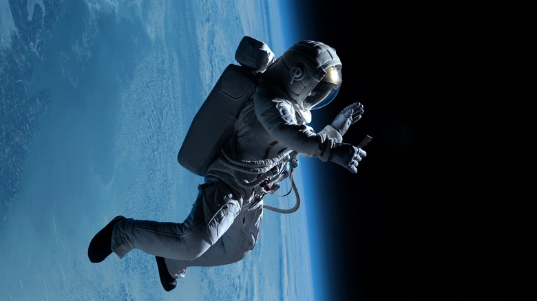 astronaut on a video call during a spacewalk